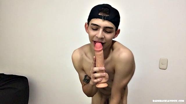 Paul is a skinny Latino, who starts his solo standing and teases us, as he strips naked. By the time the clothes are on the floor, Paul is fingering his ass and working up a boner.