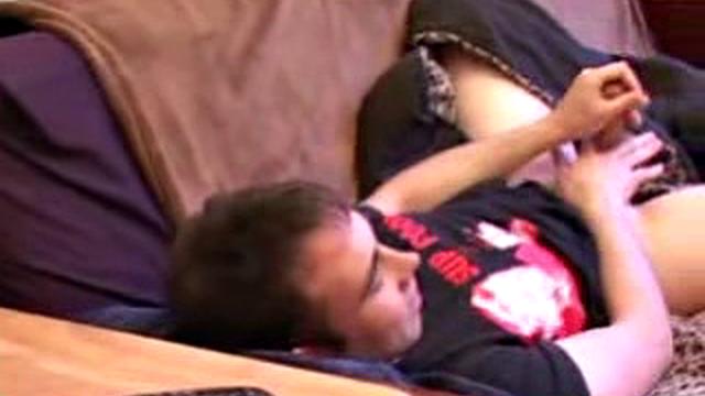 As he watches a porn video on TV, Tapher Blaze is stroking his stiff cock. After a good long jerk off session, the horny boy spews cum all over his chest and licks it off.