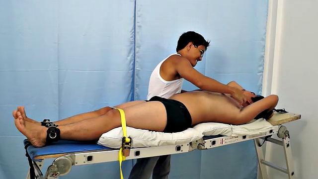 Chubby Asian boy Julius returns to Laughing Asians for a laughter-filled gay tickling excursion on our tickle rack.