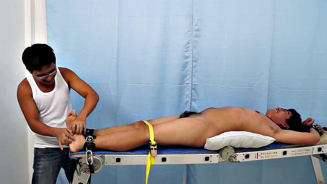 Chubby Asian boy Julius returns to Laughing Asians for a laughter-filled gay tickling excursion on our tickle rack.