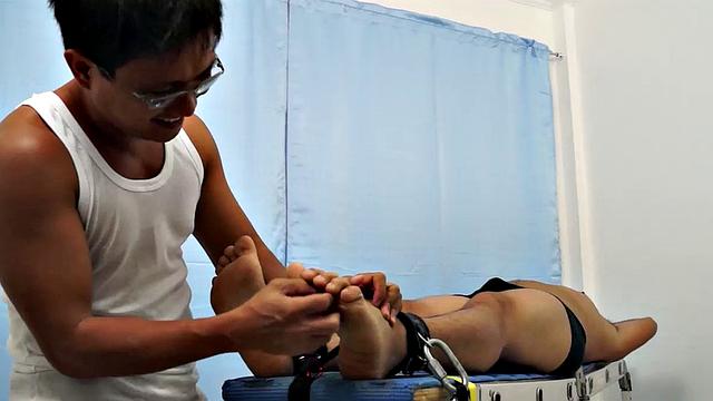 Chubby Asian boy Julius returns to Laughing Asians for a laughter-filled gay tickling excursion on our tickle rack.