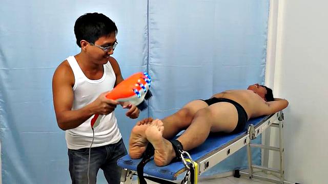 Chubby Asian boy Julius returns to Laughing Asians for a laughter-filled gay tickling excursion on our tickle rack.