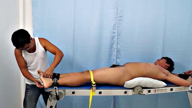 Chubby Asian boy Julius returns to Laughing Asians for a laughter-filled gay tickling excursion on our tickle rack.