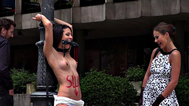 BDSM babe publicly whipped and humiliated by master and mistress