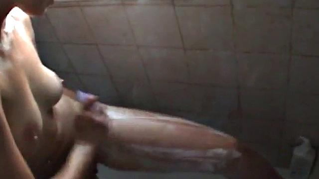 Hot babe masturbates in the shower