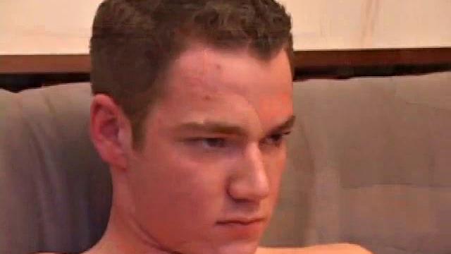 Brayden jerks off on the sofa while he watches a porn video, then scoots to the floor to suck on the head of his cock. After a good stroking, Brayden shoots his cum load on his tongue and face.