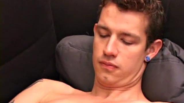 Elliot unzips his jeans and pulls out his growing cock. After giving it a good stroking, he stuffs fingers up his ass for added stimulation. This does the trick, and soon he's shooting himself in the face.