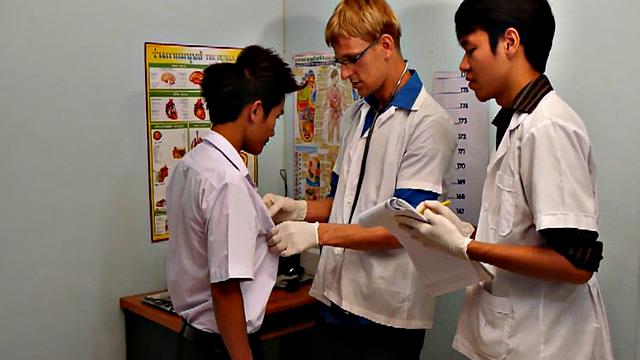 Asian twink fucked in medical 3some by doctors