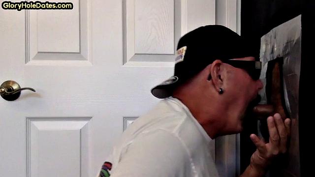 Gloryhole DILF sucks cock in amateur home video