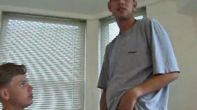 Christian and Richie sit on the sofa, watching a porn video while slowly rubbing their crotches. Richie shyly takes out his dick and watches as Christian strips off his shorts and exposes an impressive cock.