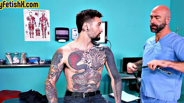 Analfisted tattooed jock in 3some by doctor