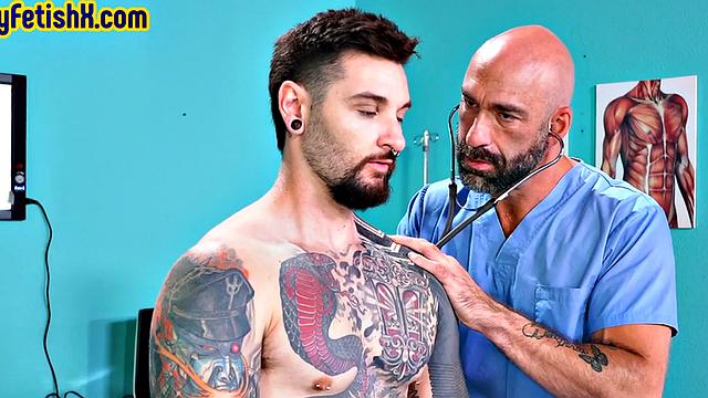 Analfisted tattooed jock in 3some by doctor