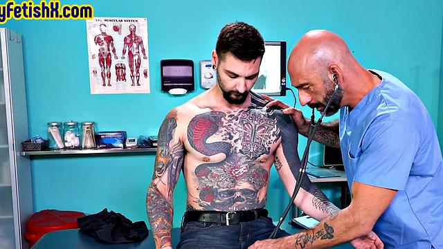 Analfisted tattooed jock in 3some by doctor