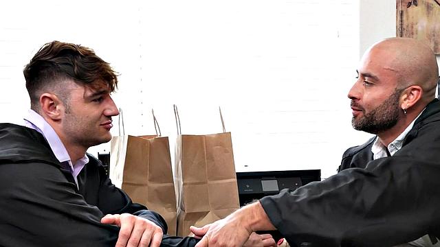 Mesmerized jock oils ass and gets rimmed by hunk in office