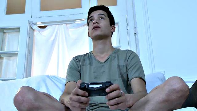 Cute young twink Joel is home playing video games while he waits for his sexy daddy to get home. Mitch arrives and oh boy is he horny.