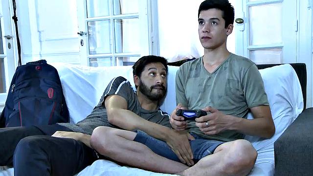 Cute young twink Joel is home playing video games while he waits for his sexy daddy to get home. Mitch arrives and oh boy is he horny.