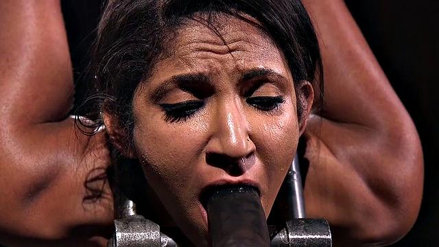 Busty bondage slut suspended and toyed by her male dom