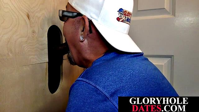 Mature daddy sucks dick through gloryhole