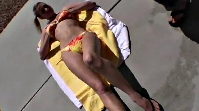 Stripteasing teen catches some rays