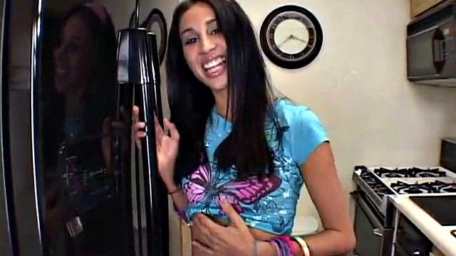 Young Yasmin showing her natural tits and pussy in the kitchen. She fingering her pussy on the kitchen table