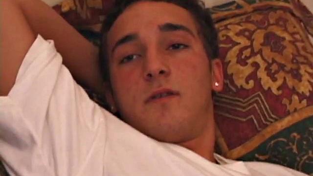 Race Banner has that sexy bad boy look that so many enjoy. He's stretched out on the bed, watching a porn video and rubbing his rapidly growing cock. His shirt comes off and he slides a hand inside his pants to pull at the stiff dick inside.