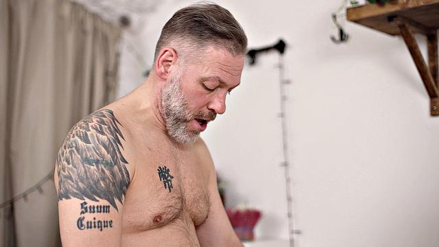 Tattooed man inspects wet pussy