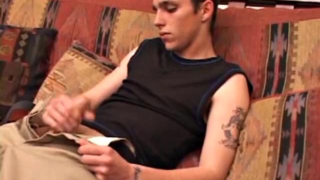 After rubbing up a stiff one, Sean unzips and starts stroking his hard cock and pleasures himself with his tongue. He eats his pre-cum, plays with his balls, and pumps out a huge cum gushing load.