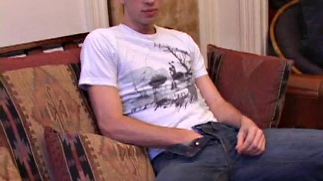 While watching a porn video, Gabriel Turner gets himself hard and then lubes his stiff dick for self-pleasuring.