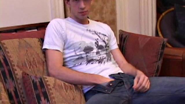 While watching a porn video, Gabriel Turner gets himself hard and then lubes his stiff dick for self-pleasuring.