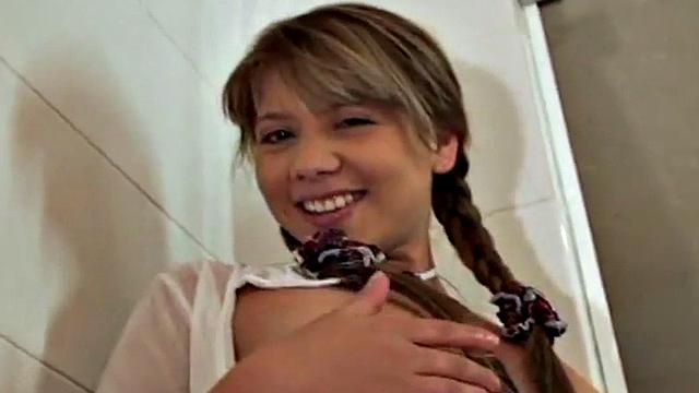 Watch this naughty 18-year-old get off with her small tits & pigtails in the bathroom