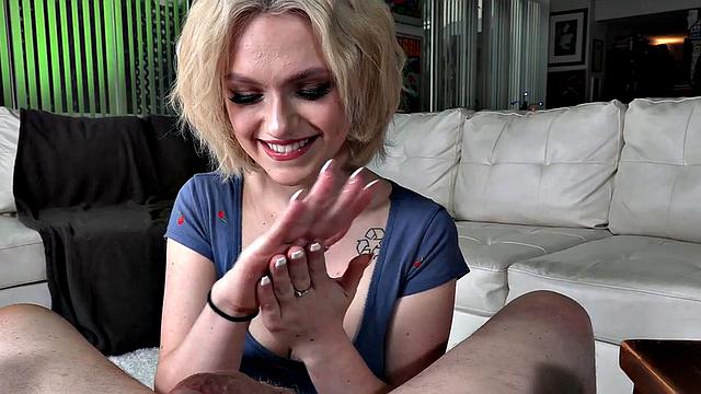 Tugging busty babe jerks stiff cock in dirty talking POV