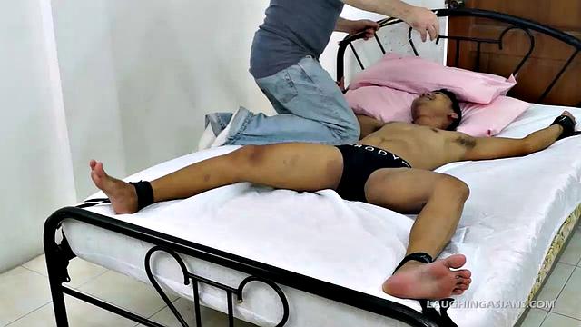 Me and a few of my cute ticklish Asian twinks are together for an afternoon of tickle fetish fun. Today we have the adorable sexy Asian boy Lance tied down spreadeagled on the bed.
