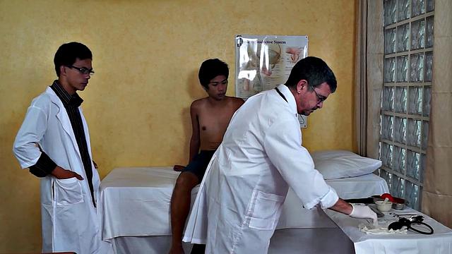 Petite Asian twink sucks doctors in 3some