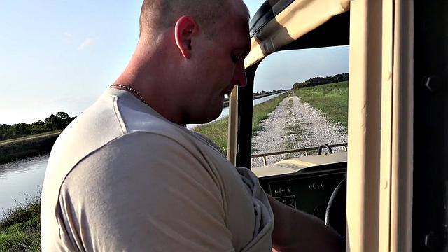 Outdoor soldier fucks military bottom on truck