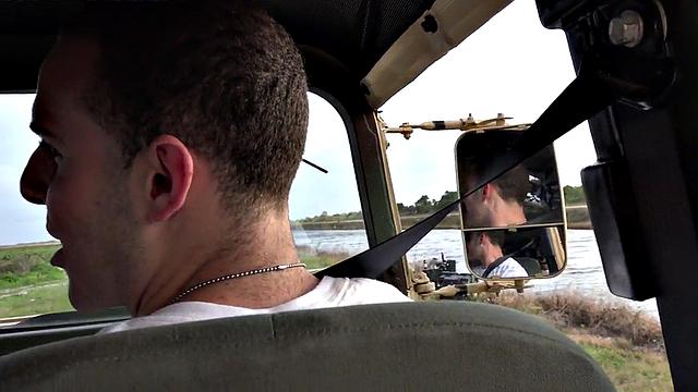 Outdoor soldier fucks military bottom on truck