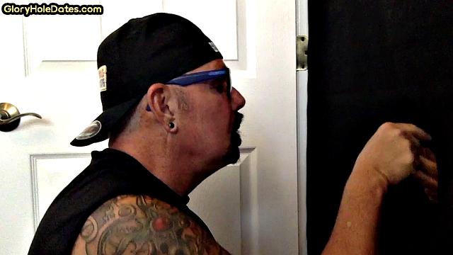 Real tattooed gay daddy sucks gloryhole at home