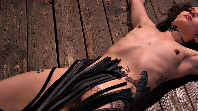 Submissive tattooed babe whipped after dildo blowjob