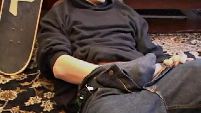 After some skateboarding, Christian Wilde works up a stiff one thru his pants and pulls it out. Some double-handed stroking eventually sends a cum gusher onto his chest.