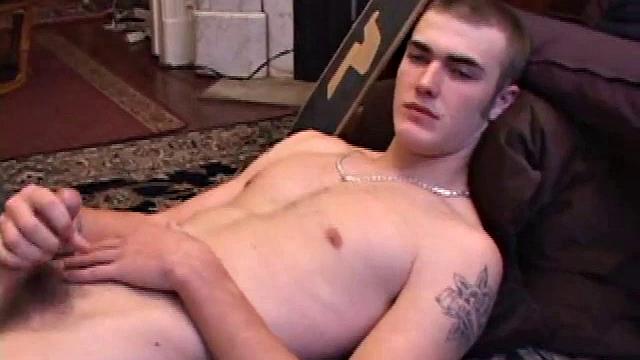 After some skateboarding, Christian Wilde works up a stiff one thru his pants and pulls it out. Some double-handed stroking eventually sends a cum gusher onto his chest.