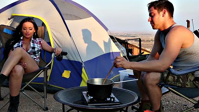 Watch this tattooed brunette give a wild outdoor blowjob and handjob while getting her trimmed pussy pounded hard