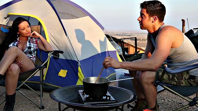 Watch this tattooed brunette give a wild outdoor blowjob and handjob while getting her trimmed pussy pounded hard