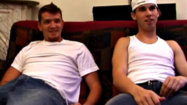 Lic seems very much at ease with Tapher. Both guys are in jeans and t-shirts, but lose them as they settle into each other. First, Lic slides his hand down his pants to work up a stiff one, while Tapher rubs one up from the outside.