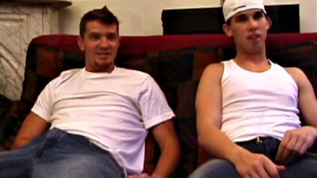 Lic seems very much at ease with Tapher. Both guys are in jeans and t-shirts, but lose them as they settle into each other. First, Lic slides his hand down his pants to work up a stiff one, while Tapher rubs one up from the outside.