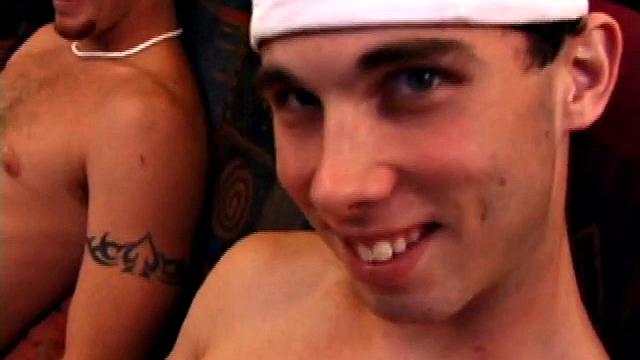 Lic seems very much at ease with Tapher. Both guys are in jeans and t-shirts, but lose them as they settle into each other. First, Lic slides his hand down his pants to work up a stiff one, while Tapher rubs one up from the outside.