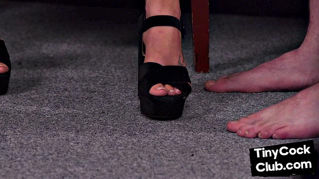 Big-titted femdom babe jerking small cock in locker room