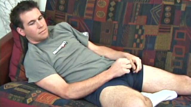 New comer pops in a porn video and slides his hands down his pants. He rubs his dick through his blue boxers, until it's stiff and ready to action. Then starts stroking his boner with determination until it releases its load.