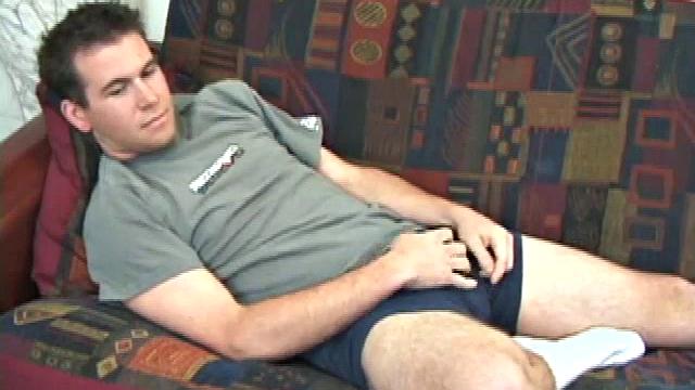 New comer pops in a porn video and slides his hands down his pants. He rubs his dick through his blue boxers, until it's stiff and ready to action. Then starts stroking his boner with determination until it releases its load.