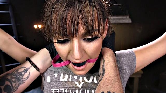 Gagged BDSM slave fingered by master