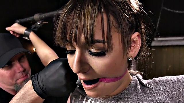 Gagged BDSM slave fingered by master