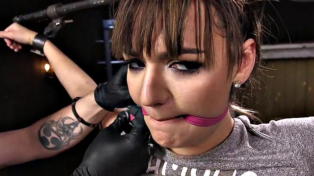 Gagged BDSM slave fingered by master